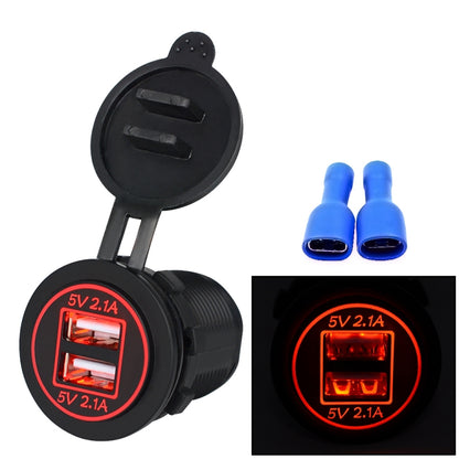 Dual USB car charger with red LED light, two USB ports on black circular face.
