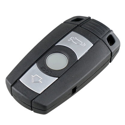 Black key fob remote with lock, unlock, and trunk buttons; silver center panel