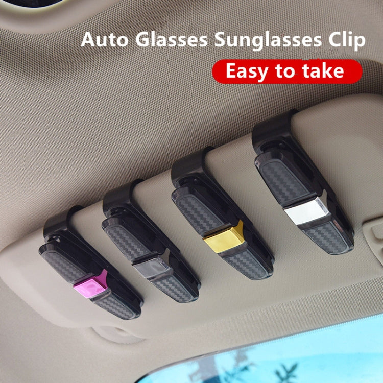 Car eyeglasses clip holder set, multiple black clips mounted on car headliner