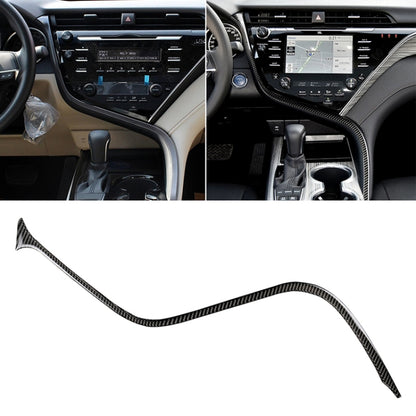 Carbon fiber-look center console trim sticker with S-curve around the dashboard controls