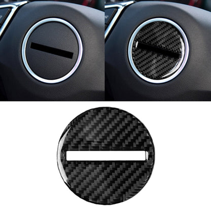 Circular carbon-fiber steering wheel logo sticker with chrome ring and black bar