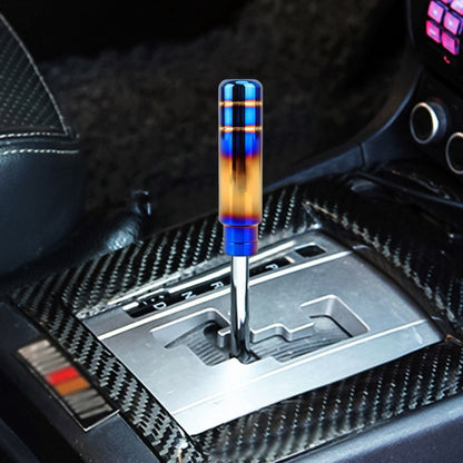 Colorful flame-style car gear shift knob with blue and gold finish on silver base