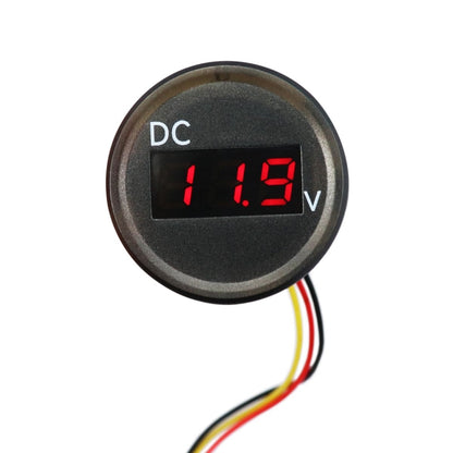 Round digital DC voltmeter with red LED display reading 11.6V