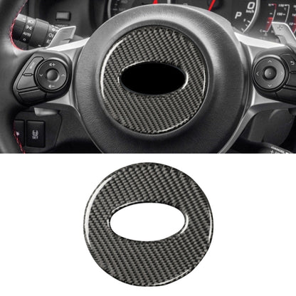Carbon fiber steering wheel center sticker, round with oval cutout, black weave
