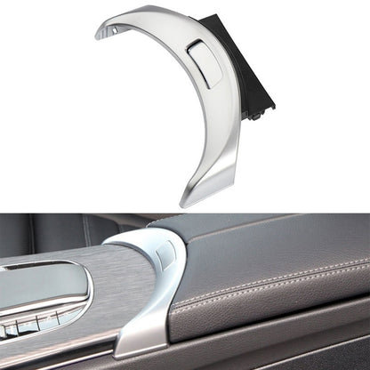 Silver car armrest switch cover with rectangular button cutout and black side tabs