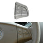 Light grey 4-button steering wheel switch panel with volume and phone-style icons