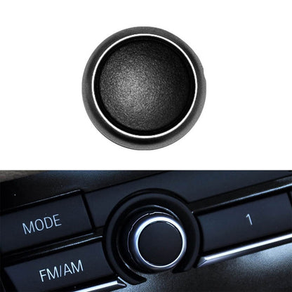 Round car audio switch button with black center and chrome ring