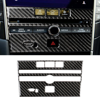 Carbon fiber CD console panel sticker with button cutouts, installed on car dashboard