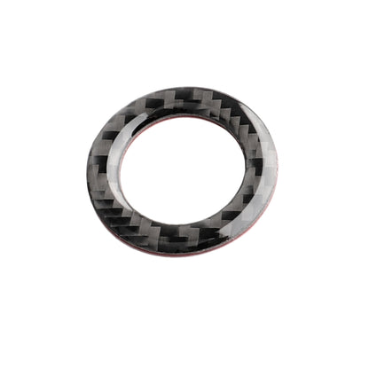 Black carbon-fiber one-button start bezel ring with chrome edge