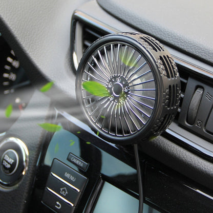 Portable car air outlet fan with round vented grille and black stand clip