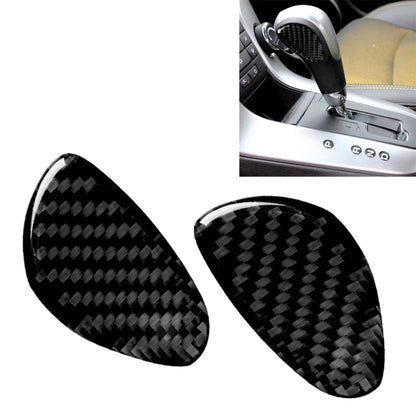 Pair of black carbon-fiber gear shift panel stickers, curved oval covers