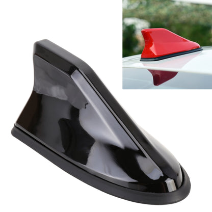 Black shark-fin car antenna with glossy shell and wide mounting base