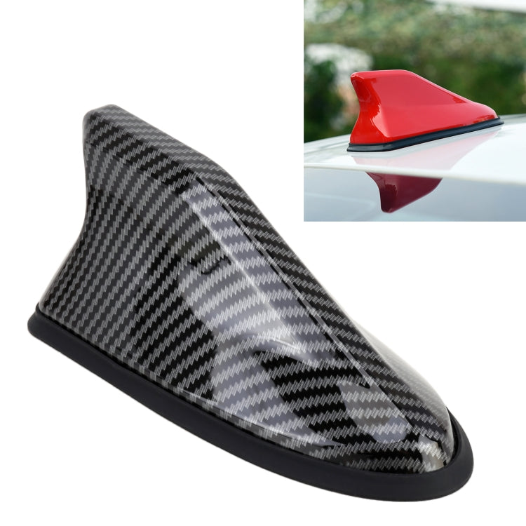 Carbon fiber black shark-fin car antenna with textured pattern and mounting base