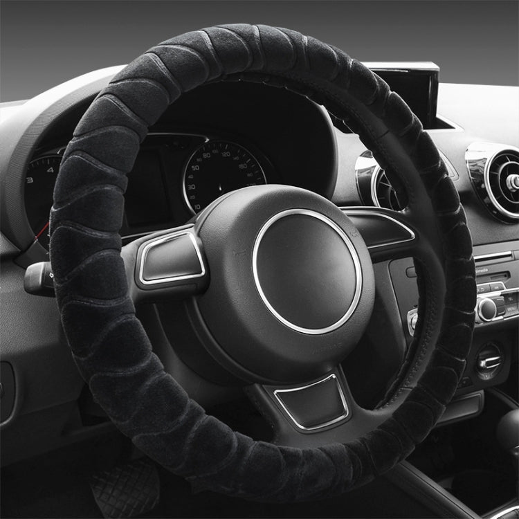 Black plush steering wheel cover with ribbed texture, anti-slip grip.