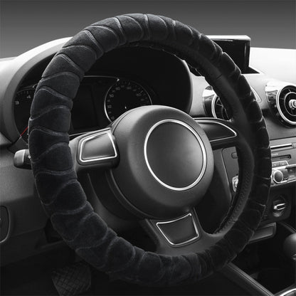 Black plush steering wheel cover with ribbed texture, anti-slip grip.