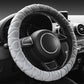 Light gray plush steering wheel cover with ribbed texture, anti-slip grip.