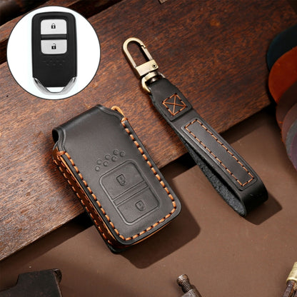Black leather key fob protective cover with double button cutouts and orange stitching