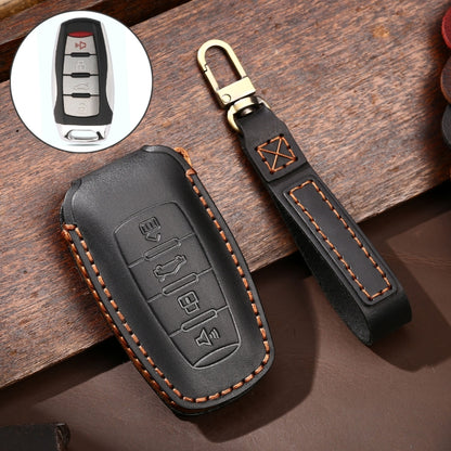 Black cowhide leather key case with embossed button icons and leather keyring strap