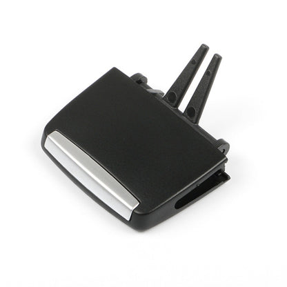 Black plastic air vent louver clip with silver insert and mounting pins