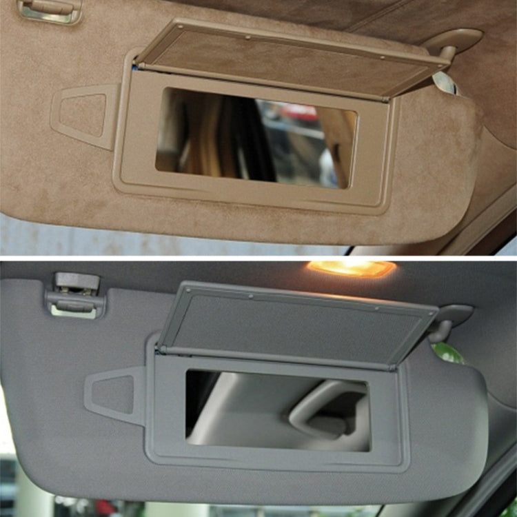 Car sun visor makeup mirror installed on beige and grey visor panels