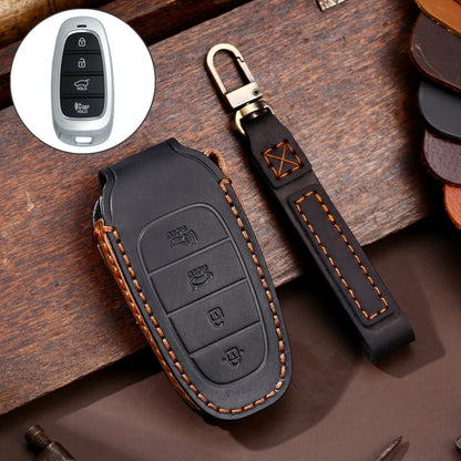 Black cowhide leather key fob cover with 4-button insert and keyring, stitched trim