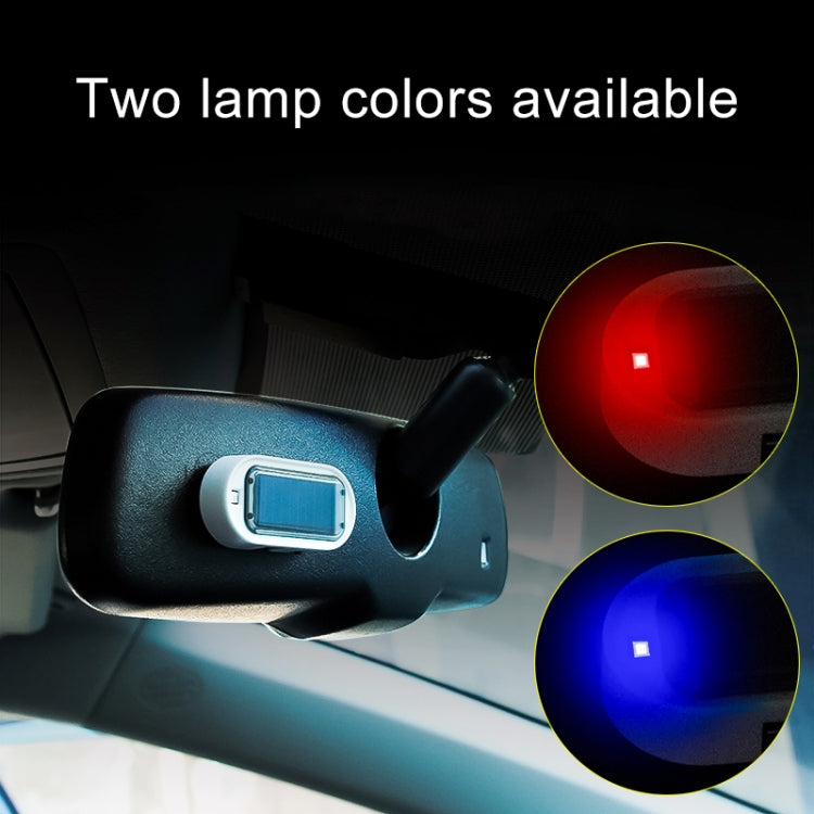Solar LED warning light mounted in car interior, emitting red warning glow