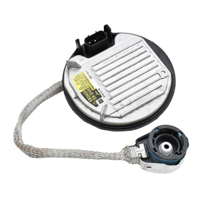 Round xenon lamp ballast module with electrical connectors and gray braided cord