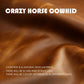 Brown cowhide leather material close-up with natural grain and soft wrinkles