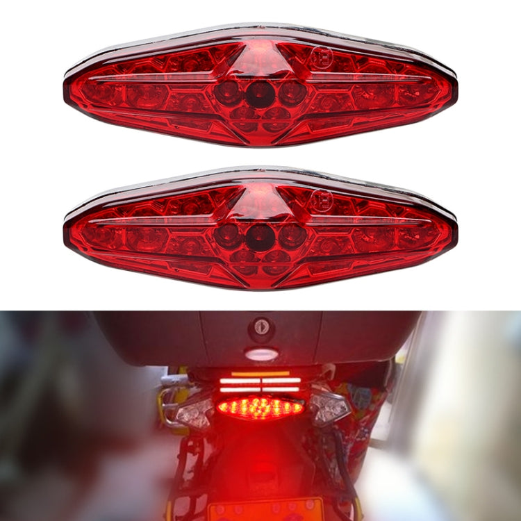Motorcycle LED running light pair with red lenses, illuminated bright red brake light