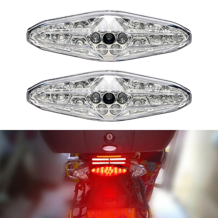 Motorcycle LED running light with clear lens and black housing, illuminated red brake glow