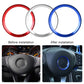 Steering wheel decorative ring set: red, silver, and blue; blue ring installed
