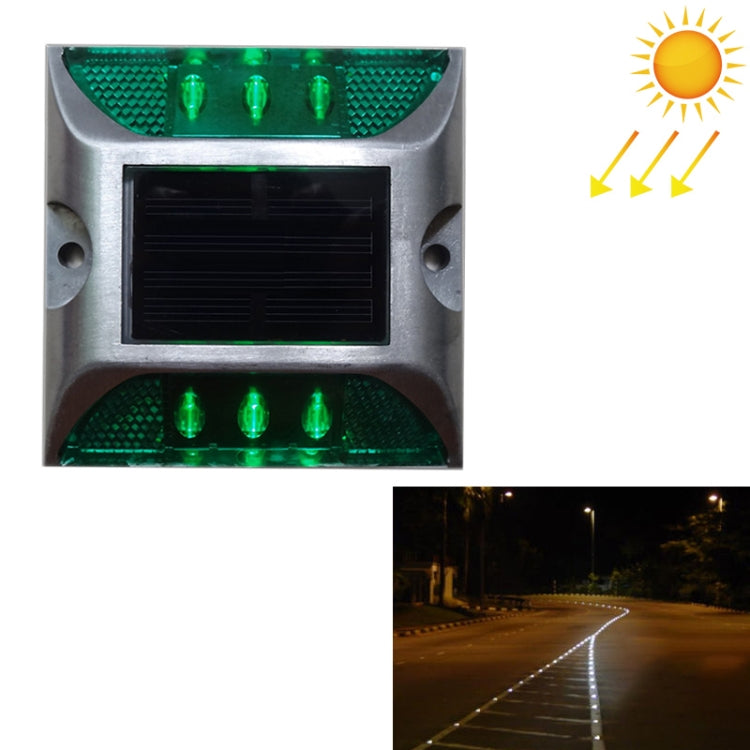 Solar LED road stud light with green flashing lenses and solar panel window