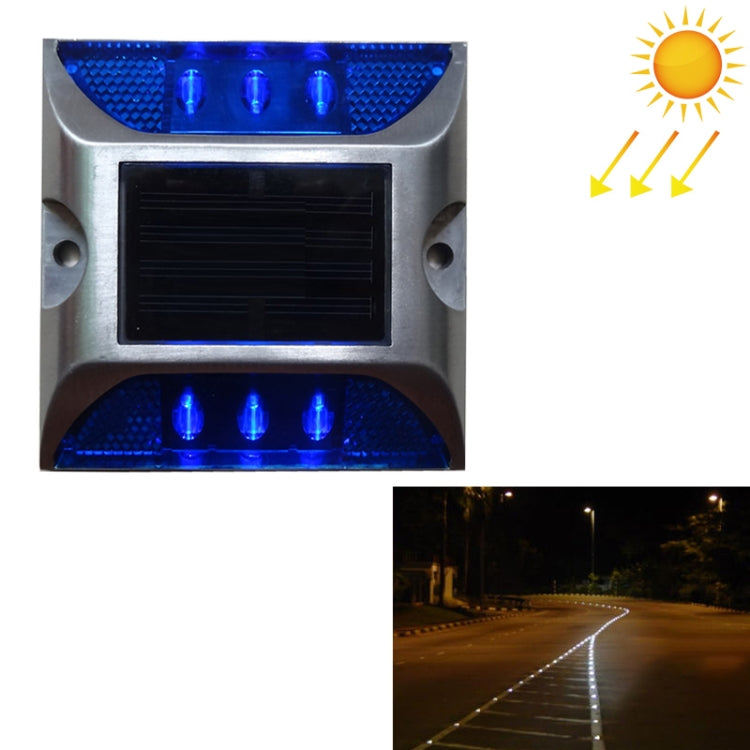 Solar LED road stud light with blue flashing lenses above and below solar panel