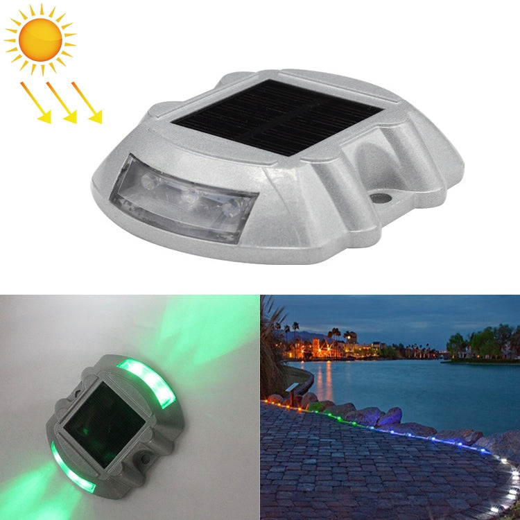 Solar horseshoe road stud light with clear lens and black solar panel, off