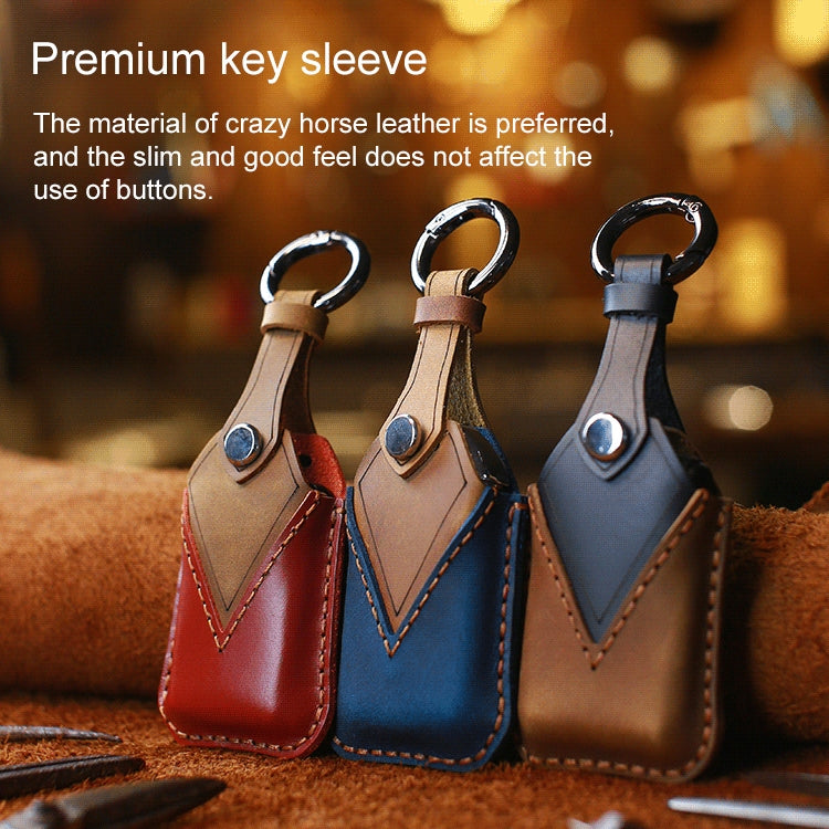 Set of three cowhide leather key sleeves in red, blue, and tan, each with key ring
