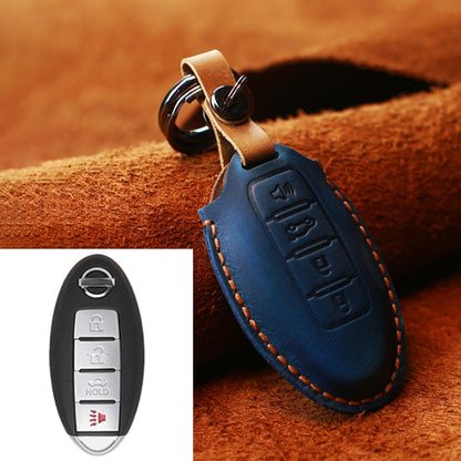 Blue leather key fob cover with metal key ring, tan strap, and stitched edges