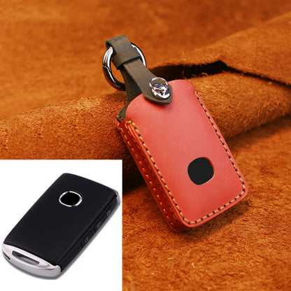 Red leather key fob protective cover with metal key ring and round button cutout