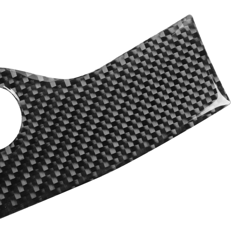 Close-up carbon fiber headlight switch panel sticker strip with circular cutout