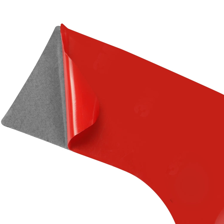 Red protective backing sheet with curved cut edge for headlight switch panel sticker