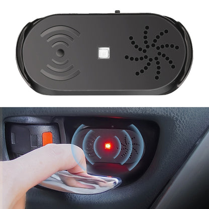 Black car door opener alarm fob with speaker grille and small LED indicator light