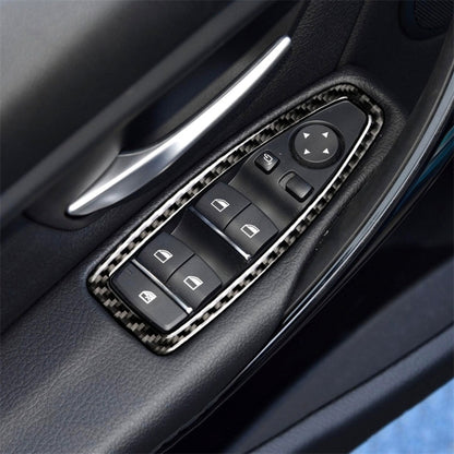 Carbon fiber effect window switch panel trim sticker with button outlines on dark console