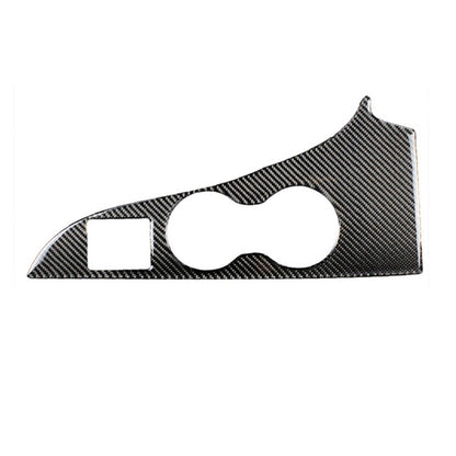 Carbon-fiber style cup holder panel sticker with two cutouts, dark textured finish