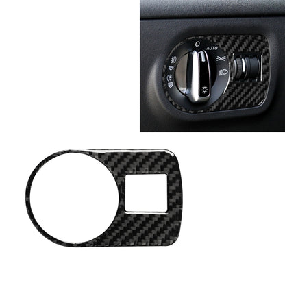 Carbon fiber headlight switch trim sticker on dashboard control panel, left drive