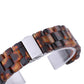 Tortoiseshell resin watch strap with silver clasp close-up and link details