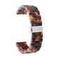 Tortoiseshell resin watch strap with silver clasp and curved segmented band