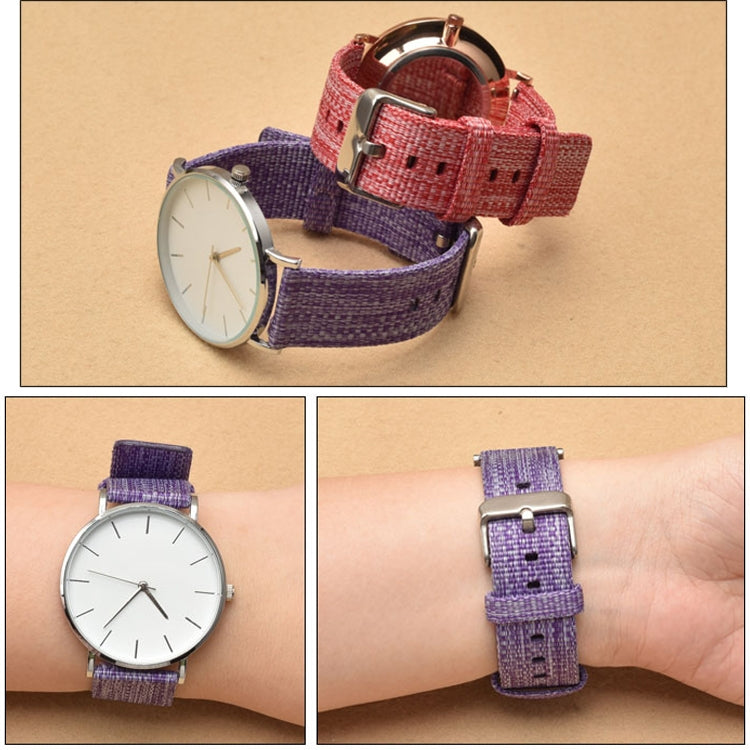 Canvas watch straps in purple, red, and orange with metal buckles