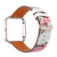 White leather-style Fitbit Blaze watch strap with pink floral pattern and metal buckle