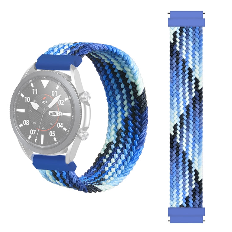 Woven nylon watch strap in blue and white zigzag weave; plastic clasp tabs visible.