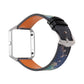 Smartwatch with black leather strap and blue/orange patterned backing, metal buckle detail