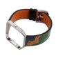 Smartwatch with orange leather strap and green/blue abstract pattern, silver clasp and pin